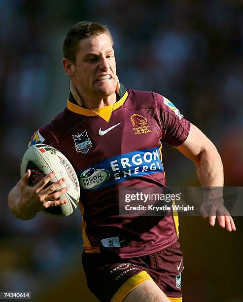 Brent Tate of the Broncos makes a break during the round 11 NRL match between the Brisbane Broncos and the Newcastle Knights at Suncorp Stadium May...