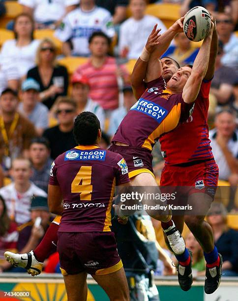 Brent Tate of the Broncos catches a high ball infront of a Knights opponent during the round 11 NRL match between the Brisbane Broncos and the...