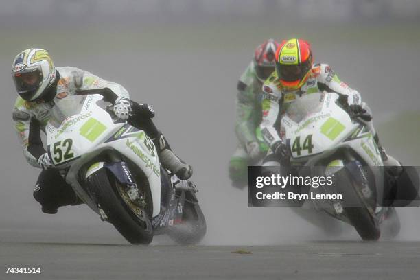 James Toseland of Great Britain and Honda in action leads team mate Roberto Rolfo of Italy during race one of the Superbike World Championship at...