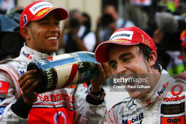 Fernando Alonso of Spain and McLaren Mercedes celebrates with team mate Lewis Hamilton of Great Britain after winning the Monaco Formula One Grand...