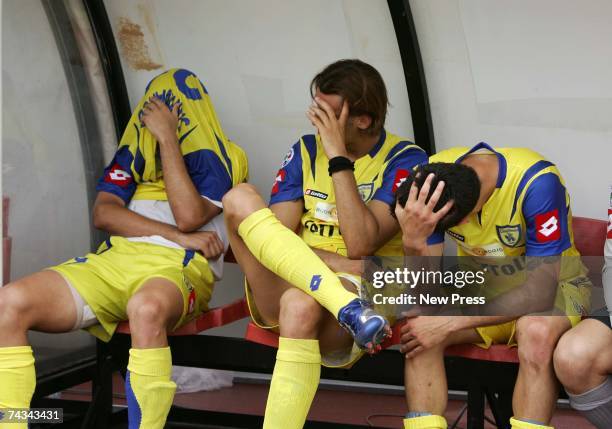 Paolo Sammarco, Cesare Rickler, and Marco Malago of Chievo Verona look dejected having been relegated to Serie B after the Serie A match between...