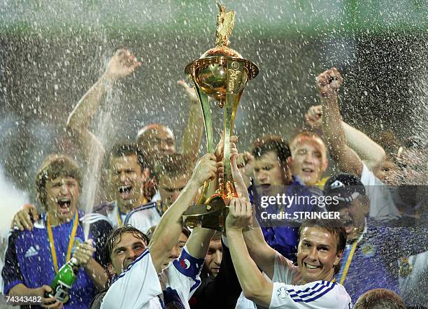 Players of Dinamo Kiev Vladislav Vaschuk and Valentin Belkevich jubilate with Cup on Olympiyski stadium in Kiev at final match of football Cup of...