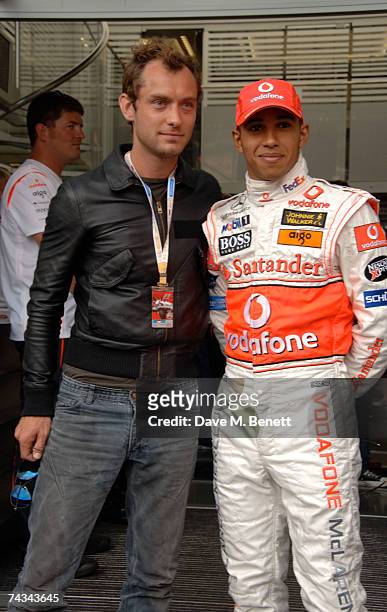 Actor Jude Law and Lewis Hamilton of Great Britain and McLaren Mercedes meet in the paddock before the Monaco Formula One Grand Prix at the Monte...