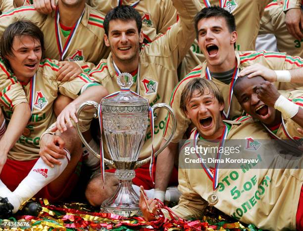 Moscow's Lokomotiv team celebrates their victory during the Russian Cup final match between Lokomotiv Moscow and FC Moskva at the Luzhniki Stadium,...