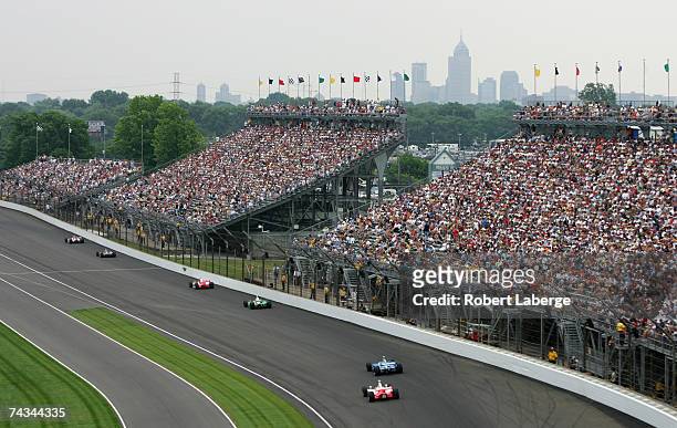 The downtown skyline overlooks the track during the IRL Indycar Series 91st running of the Indianapolis 500 at the Indianapolis Motor Speedway May...