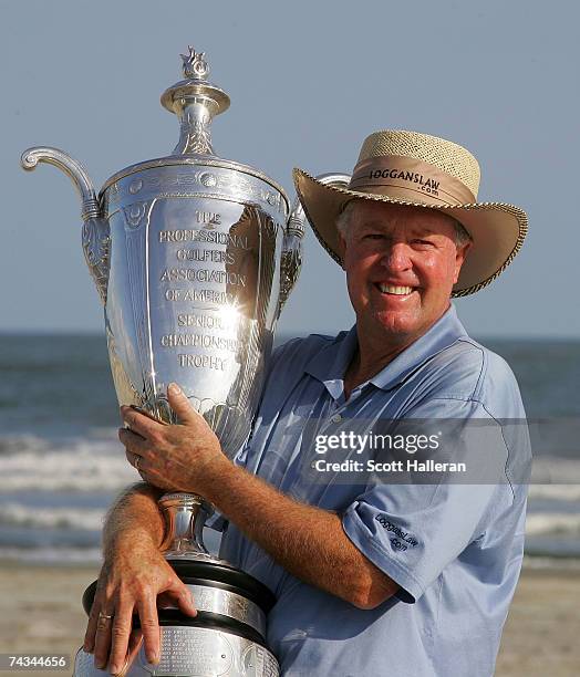 Denis Watson of Zimbabwe poses with the trophy after his two-stroke victory at the Senior PGA Championship on the Ocean Course at the Kiawah Island...