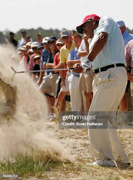 Eduardo Romero of Argentina hits a shot from the sand on the 14th hole during the final round of Senior PGA Championship on the Ocean Course at the...