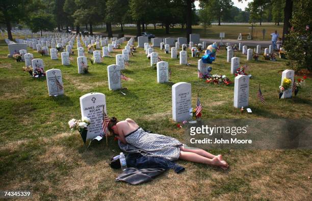 Mary McHugh mourns her slain fiance Sgt. James Regan at "Section 60" of the Arlington National Cemetery May 27, 2007. Regan, a US Army Ranger, was...