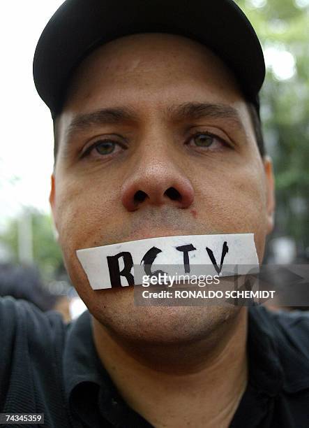 Venezuelan with his mouth taped protests against the closure of the broadcast station RCTV outside the Venezuelan embassy in Mexico City on May 27th,...