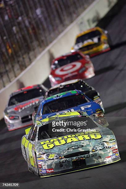 Casey Mears, driver of the National Guard Chevrolet, leads a group of cars during the NASCAR Nextel Cup Series Coca-Cola 600 on May 27, 2007 at...
