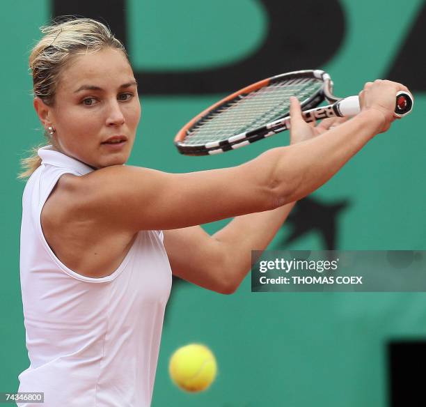 French player Severine Bremond hits a backhand shot to Dutch player Michaella Krajicek during their French Tennis Open first round match at Roland...