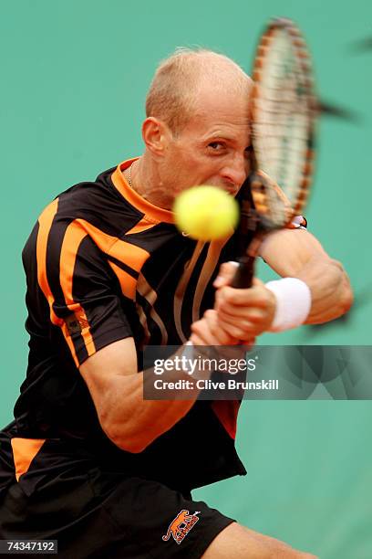 Nikolay Davydenko of Russia returns a shot to Stefano Galvani of Italy during the Men's Singles 1st Round match on day two of the French Open at...