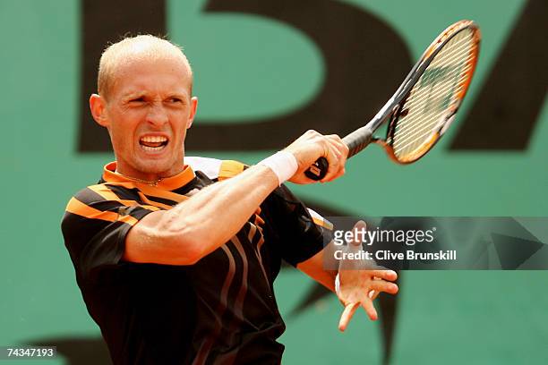 Nikolay Davydenko of Russia returns a shot to Stefano Galvani of Italy during the Men's Singles 1st Round match on day two of the French Open at...
