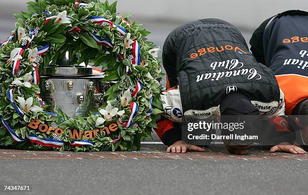 Dario Franchitti, driver of the Canadian Club Andretti Green Racing Dallara Honda, kisses the famous yard of bricks during the Official Borg Warner...