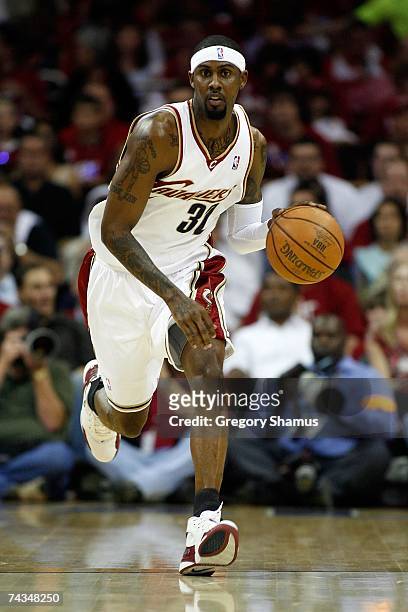 Larry Hughes of the Cleveland Cavaliers brings the ball upcourt against the Detroit Pistons in Game Three of the Eastern Conference Finals during the...