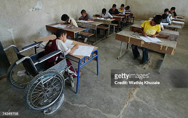 Iraqi boys take their final examinations on May 29, 2007 in a school in the Sadr city neighborhood of Baghdad, Iraq. The United Nations International...
