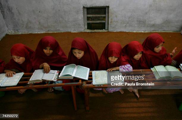 Young students study at the the women's School or Madrassa inside the compound of the Lal mosque on May 28, 2007 in Islamabad, Pakistan. The Jamia...