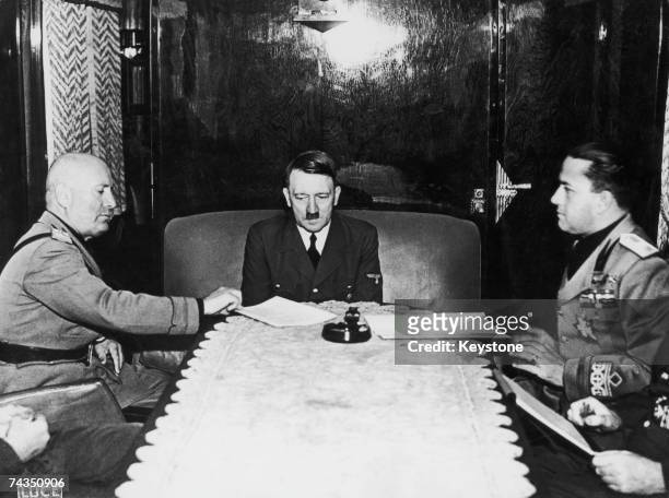 From left to right, Benito Mussolini , Adolf Hitler and Italian Foreign Minister Count Galeazzo Ciano meet at the Brenner Pass during World War II,...