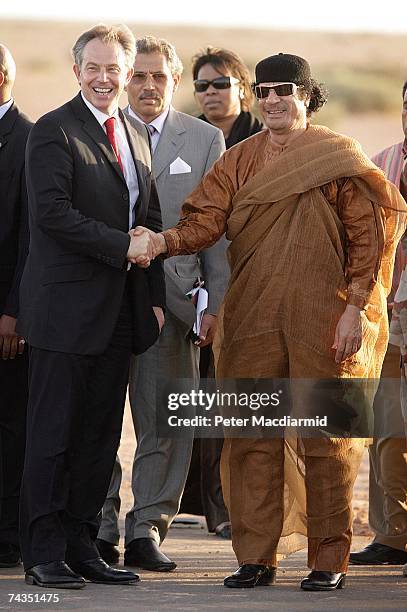 Prime Minister Tony Blair smiles as he shakes hands with Colonel Muammar Abu Minyar al-Gaddafi on May 29, 2007 in Sirte, Libya. Mr Blair is on a five...