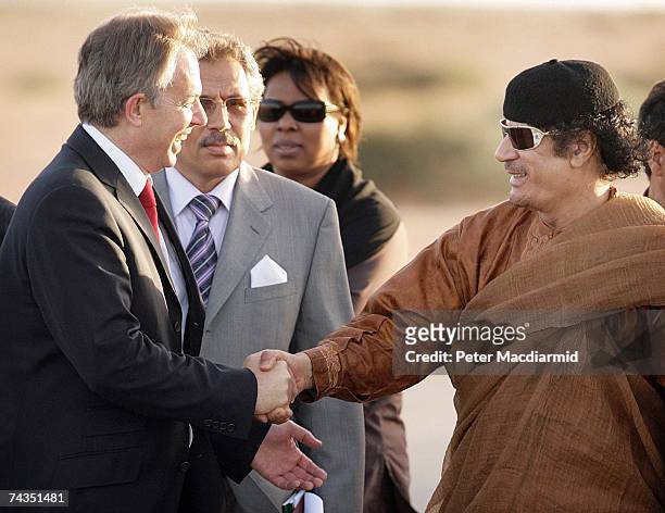 Prime Minister Tony Blair smiles as he shakes hands with Colonel Muammar Abu Minyar al-Gaddafi on May 29, 2007 in Sirte, Libya. Mr Blair is on a five...