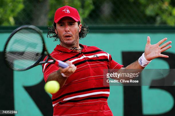 Vince Spadea of United States of America in action against Gilles Simon of France during the Men's Singles 1st round match on day three of the French...