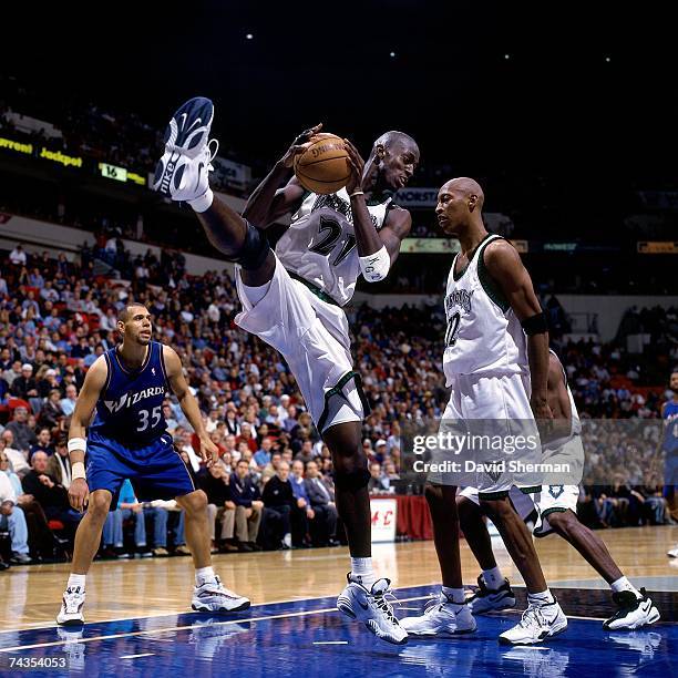 Kevin Garnett of Minnesota Timberwolves grabs a rebound against the Washington Wizards during a 1998 NBA game at the Target Center in Minneapolis,...