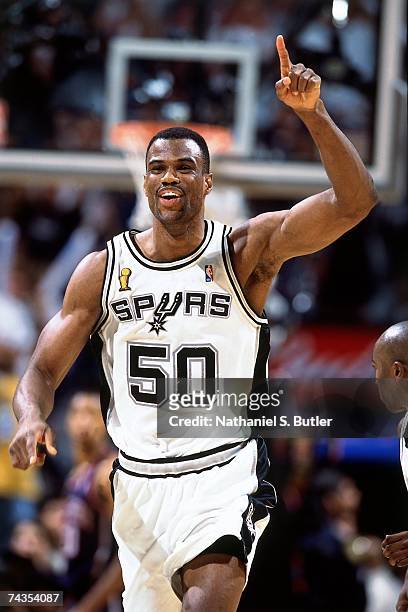 David Robinson of the San Antonio Spurs pumps his fist while running upcourt during a 2003 NBA game at the Alamodome in San Antonio, Texas. NOTE TO...