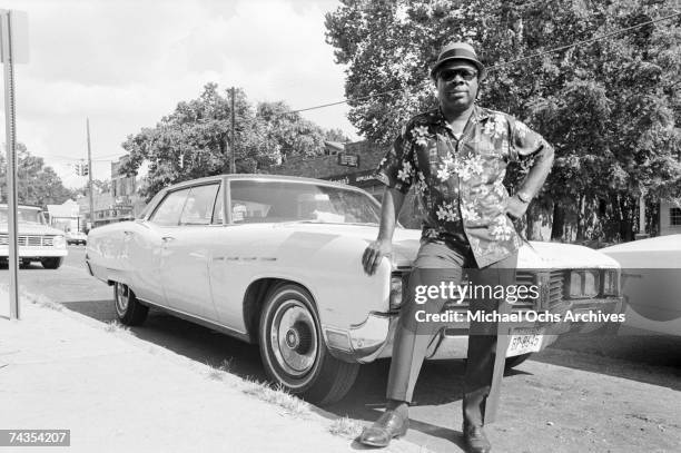 Singer Rufus Thomas poses for a photo next to a car outside Stax Records on August 8, 1968 in Memphis, Tennessee.