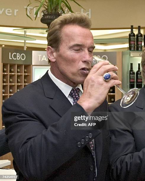 California Governor Arnold Schwarzenegger has a sip of California wine at an LCBO store 29 May 2007 in Toronto, Ontario, Canada. The Governor is on a...