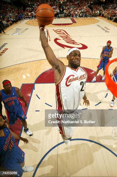 LeBron James of the Cleveland Cavaliers dunks against Rasheed Wallace of the Detroit Pistons in Game Four of the Eastern Conference Finals during the...