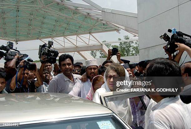 Former Bangladeshi Prime Minister Khaleda Zia gets into a vehicle after taking part in a special prayer to mark the death anniversary of her late...