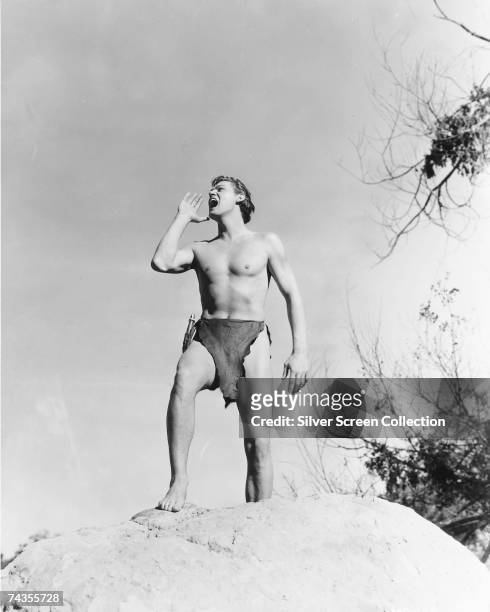 Olympic swimming champion and Hollywood actor Johnny Weissmuller as Tarzan in 'Tarzan and His Mate', directed by Cedric Gibbons, 1934.