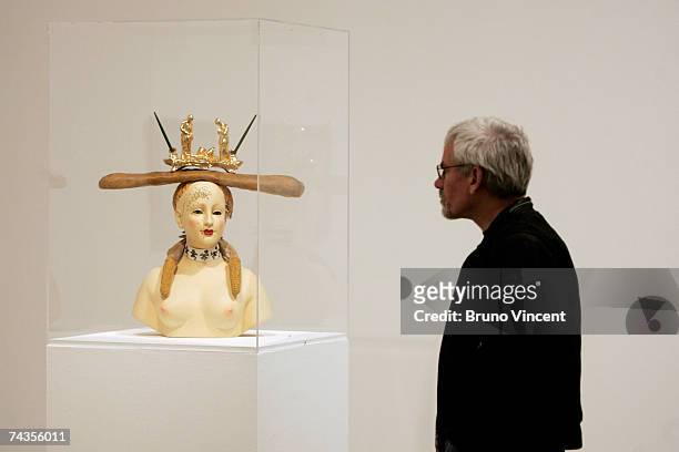 Man looks at the Dali & Film exhibition at the Tate Modern on May 30, 2007 in London. The exhibition displays the surrealist's collaborations with...