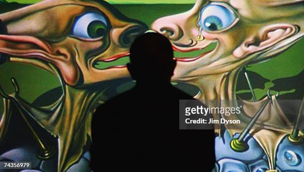 Man watches scenes from the Salvador Dali/Disney film "Destino" at the Tate Modern on May 30, 2007 in London. The exhibition displays the...