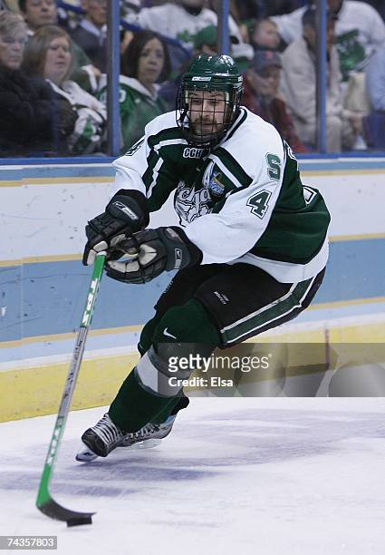Ethan Graham of the Michigan State Spartans skates with the puck against the Boston College Eagles in the Frozen Four Championship Game on April 7,...