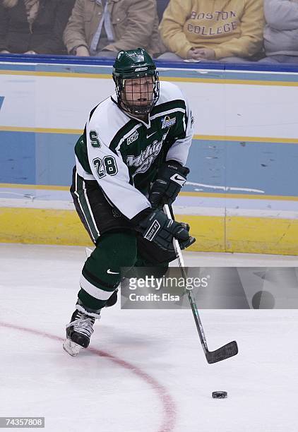 Daniel Vukovic of the Michigan State Spartans skates with the puck against the Boston College Eagles in the Frozen Four Championship Game on April 7,...
