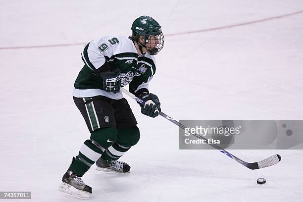 Justin Abdelkader of the Michigan State Spartans skates with the puck against the Boston College Eagles in the Frozen Four Championship Game on April...