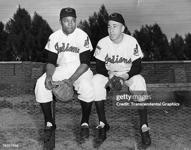 Cleveland Indians battery mates former Negro Leaguer Quincy Trouppe, catcher, on the right and Sad Sam Jones talk over the upcoming season at spring...