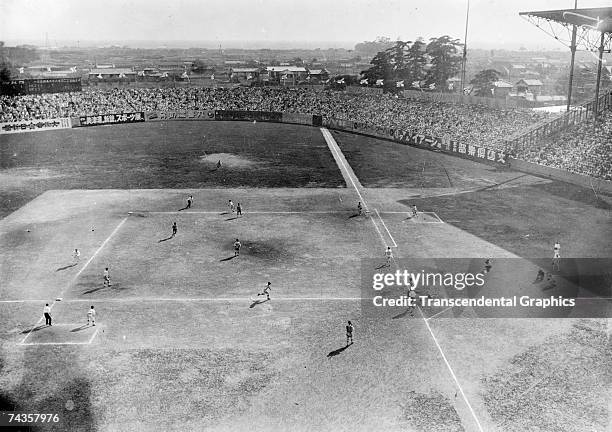 High school championship game, the World Series in Japan at this time, is underway in Koshien Stadium in Japan sometime in the 1920s.