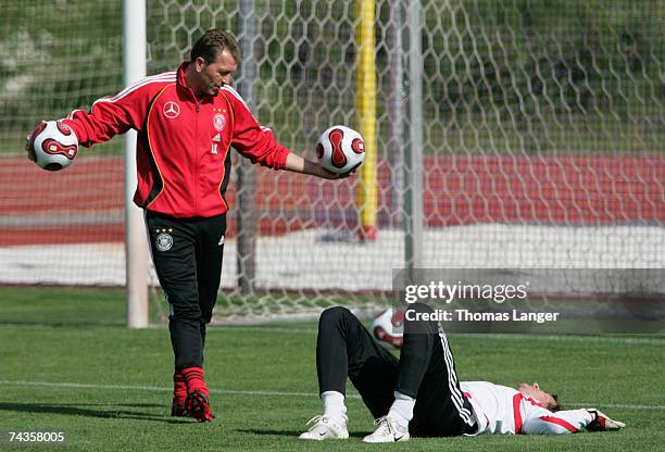 Assistant coach Andreas Koepke talks to Jens Lehmann during the German National Team training session at the Adidas-Stadium on May 30, 2007 in...