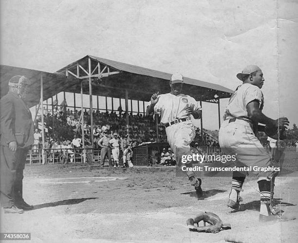 Negro League star from Cuba Pedro Formental, scores a run while playing in the Dominican Republic around 1948.