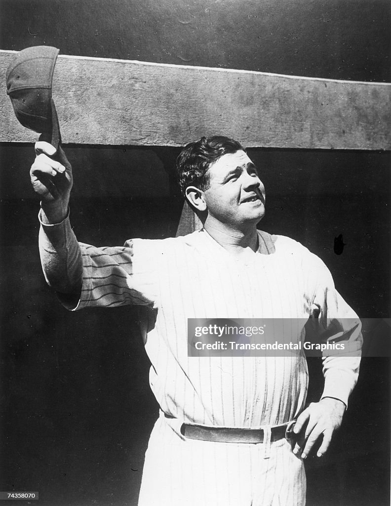 NEW YORK - C.1927. Babe Ruth salutes the crowd in Yankee Stadium with ...