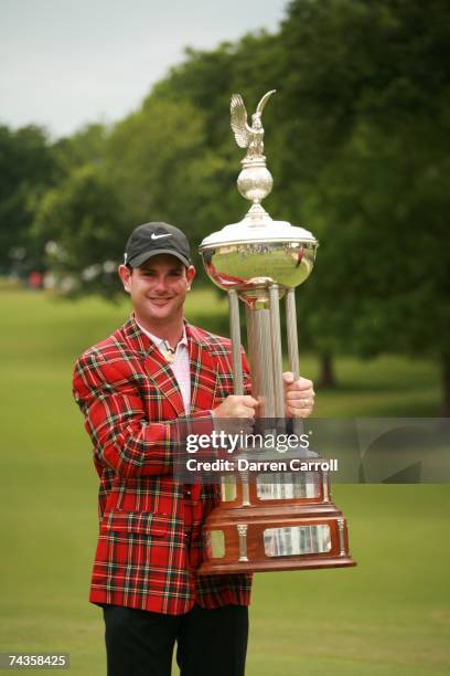 Rory Sabbatini smiles as he holds the winner's trophy while posing after his victory in the fourth round of the 2007 Crowne Plaza Invitational At...