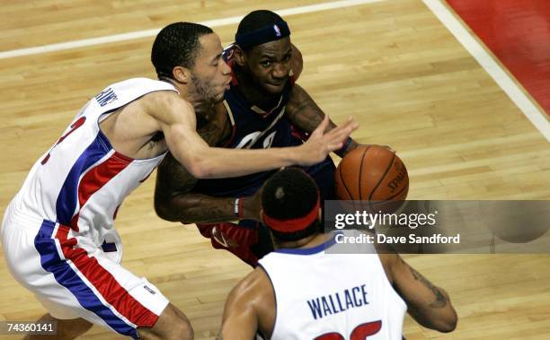 LeBron James of the Cleveland Cavaliers drives against Tayshaun Prince and Rasheed Wallace of the Detroit Pistons in Game One of the Eastern...