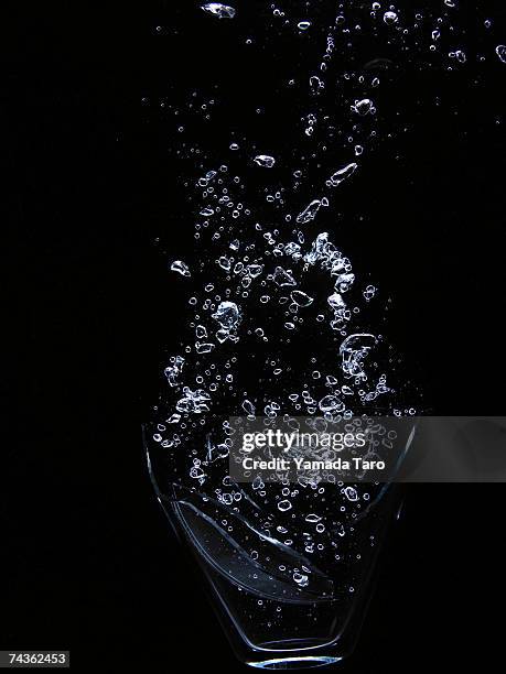 water bubbles on black background - bubbles stock-fotos und bilder