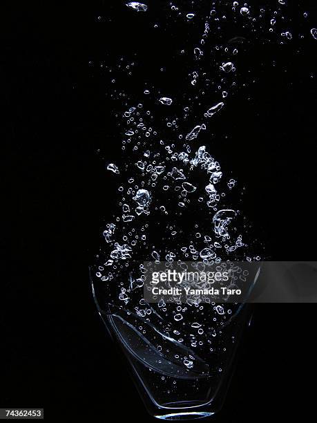water bubbles on black background - water ストックフォトと画像