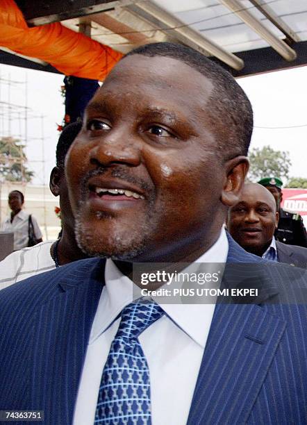 Nigerian businessman Aliko Dangote smiles during the opening of the second Lagos domestic airport MM2, 07 April 2007. AFP PHOTO / PIUS UTOMI EKPEI