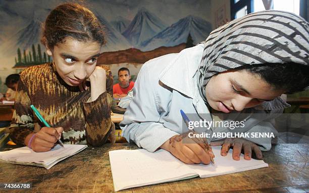 Moroccan girls attend literacy lessons to learn how to read and write in Temara, near Rabat, 30 May 2007. Some 52,8 percent of Moroccan voters are...