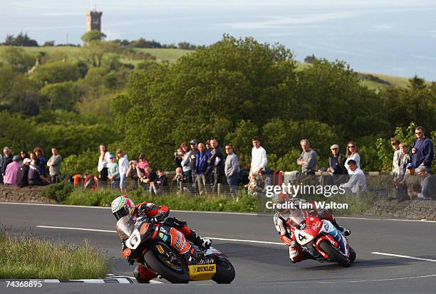 Ian Hutchinson of England and Martin Finnegan of Ireland rides during practice for the 2007 Isle of Man Tourist Trophy races on May 31, 2007 in...