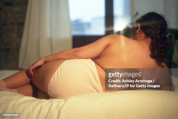 young woman on bed - 67percentcollection bildbanksfoton och bilder